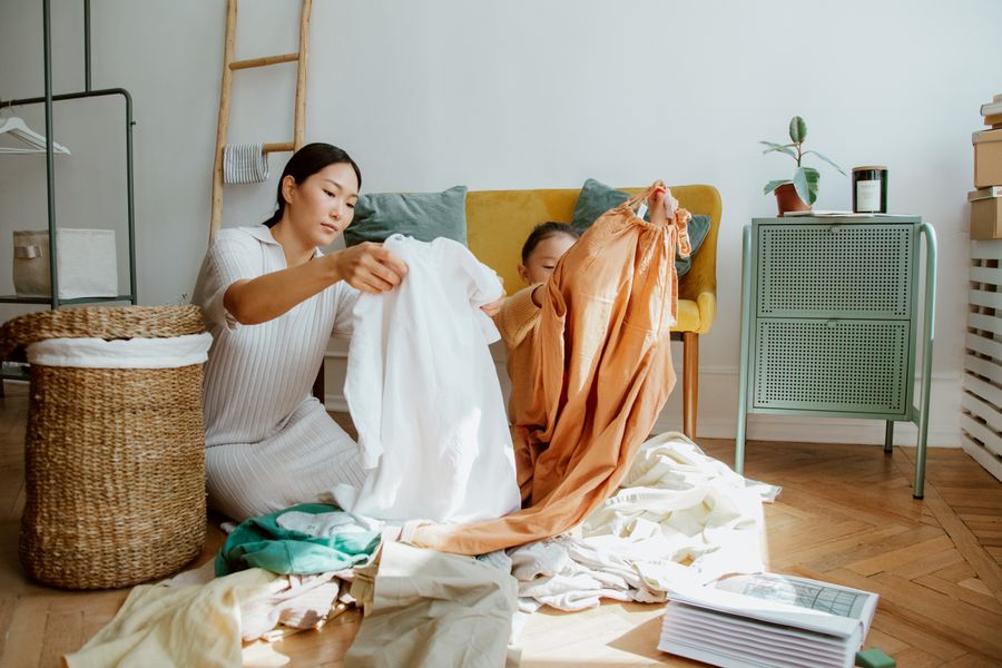 A mother and daughter using decluttering method to organize everything