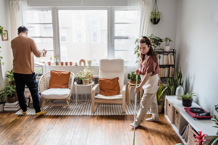 Couple doing sunday reset routine in their cozy living room